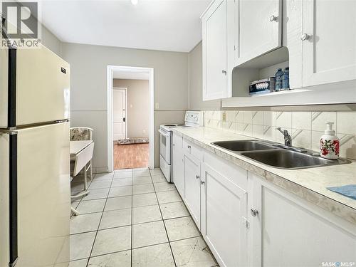 1341 103Rd Street, North Battleford, SK - Indoor Photo Showing Kitchen With Double Sink