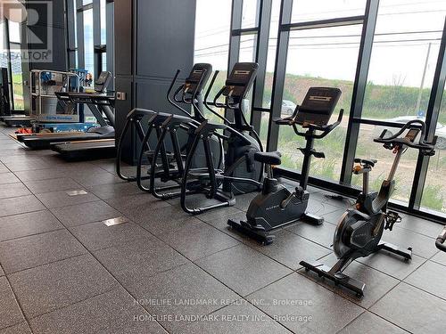 # 1214 - 3220 William Coltson Avenue E, Oakville, ON - Indoor Photo Showing Gym Room