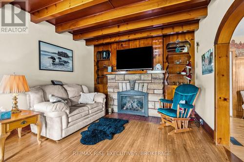 204 R33, Rideau Lakes, ON - Indoor Photo Showing Living Room With Fireplace
