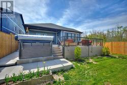 Backyard with deck and swim spa - 