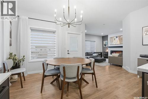 746 Bentley Manor, Saskatoon, SK - Indoor Photo Showing Dining Room With Fireplace