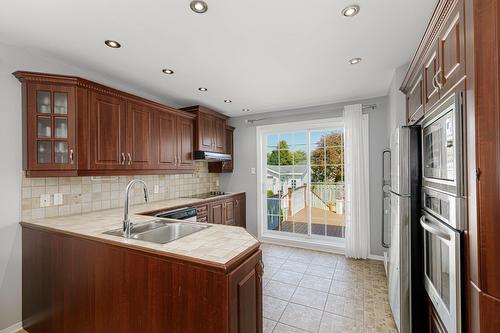 Kitchen - 3429 Rue De Toscane, Terrebonne (Terrebonne), QC - Indoor Photo Showing Kitchen With Double Sink