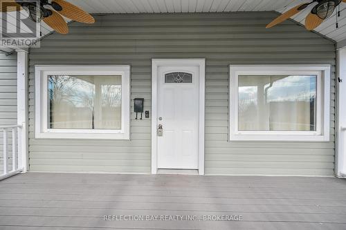 Spacious covered front porch with ceiling fans - 3794 Mathewson Avenue, Fort Erie (Crystal Beach), ON - Outdoor With Exterior