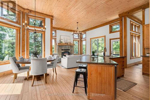 49 Estates Drive, Muskoka Lakes, ON - Indoor Photo Showing Dining Room With Fireplace