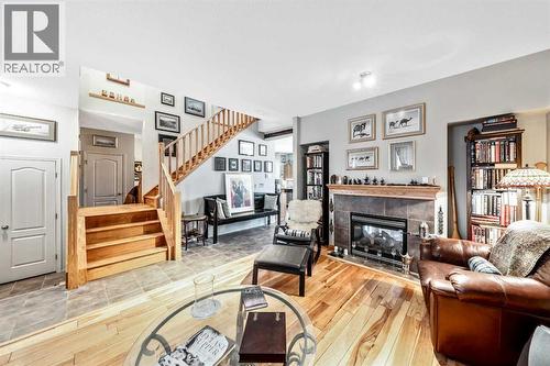 40 Mckinnon Street Nw, Langdon, AB - Indoor Photo Showing Other Room With Fireplace