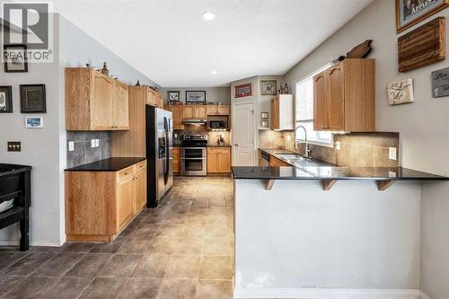40 Mckinnon Street Nw, Langdon, AB - Indoor Photo Showing Kitchen