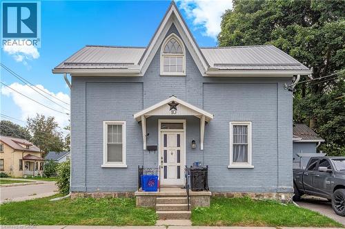 View of front facade featuring a metal roof and brick siding - 10 Centre Street, Elmira, ON - Outdoor With Facade