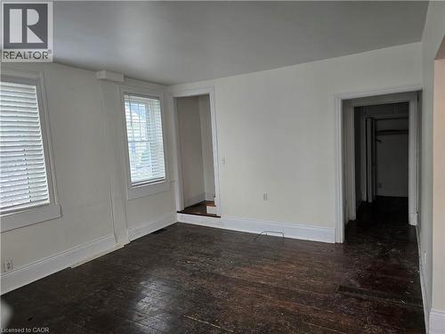 Empty room with hardwood / wood-style flooring and baseboards - 10 Centre Street, Elmira, ON - Indoor Photo Showing Other Room