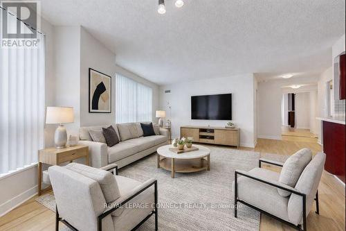 Virtually enhanced - 3111 - 36 Lee Centre Drive, Toronto, ON - Indoor Photo Showing Living Room