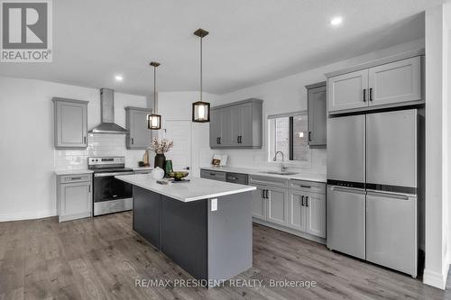 Lots of natural lighting through windows - 133 Marconi Court, London East, ON - Indoor Photo Showing Kitchen With Upgraded Kitchen