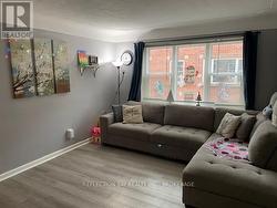 Oversized living room with brand new windows - 