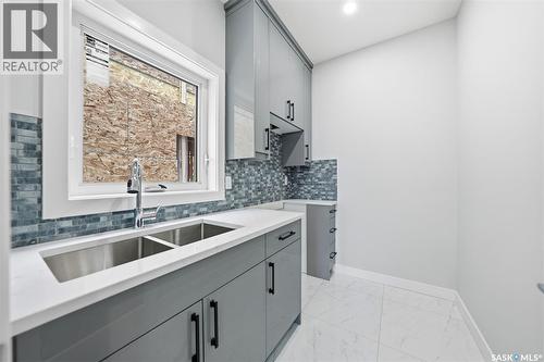 142 Sharma Lane, Saskatoon, SK - Indoor Photo Showing Kitchen With Double Sink