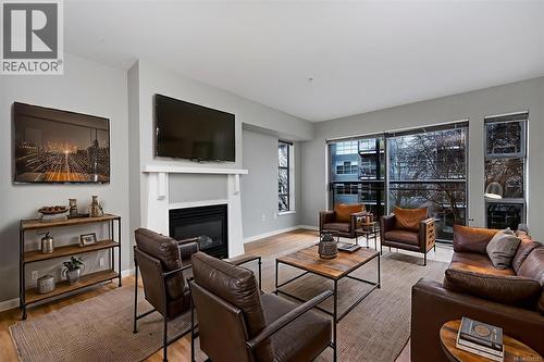 311 90 Regatta Landing, Victoria, BC - Indoor Photo Showing Living Room With Fireplace