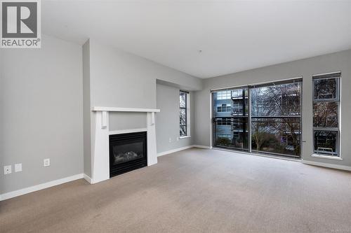 311 90 Regatta Landing, Victoria, BC - Indoor Photo Showing Living Room With Fireplace