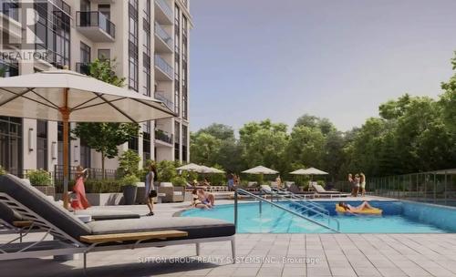210 - 204 Burnhamthorpe Road E, Mississauga, ON - Outdoor With In Ground Pool
