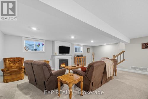 19 Statham Street, Strathroy-Caradoc (Se), ON - Indoor Photo Showing Basement With Fireplace