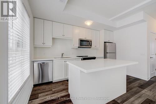 21 - 70 Kenesky Drive N, Hamilton (Waterdown), ON - Indoor Photo Showing Kitchen With Stainless Steel Kitchen With Upgraded Kitchen