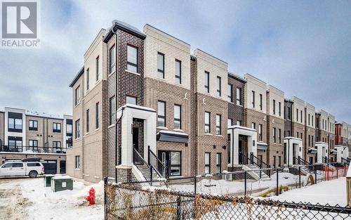 21 - 70 Kenesky Drive N, Hamilton (Waterdown), ON - Outdoor With Facade