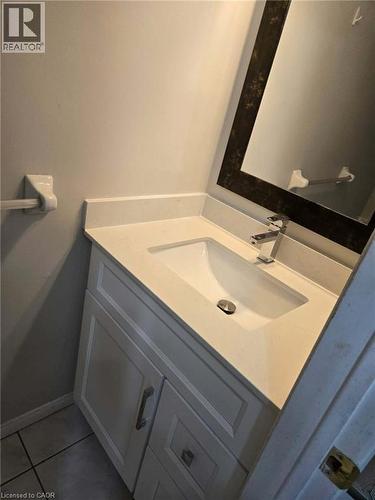 Bathroom featuring vanity and light tile patterned flooring - 185 Sulmona Drive, Hamilton, ON - Indoor Photo Showing Bathroom