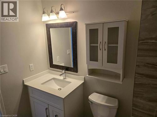 Half bath with vanity and toilet - 185 Sulmona Drive, Hamilton, ON - Indoor Photo Showing Bathroom