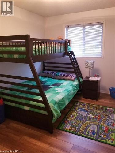 Bedroom featuring dark wood-style floors - 185 Sulmona Drive, Hamilton, ON - Indoor Photo Showing Bedroom
