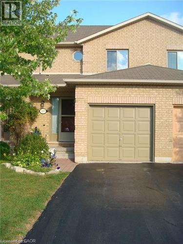 View of front of home featuring brick siding, asphalt driveway, and a shingled roof - 185 Sulmona Drive, Hamilton, ON - Outdoor