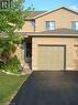 View of front of home featuring brick siding, asphalt driveway, and a shingled roof - 185 Sulmona Drive, Hamilton, ON  - Outdoor 