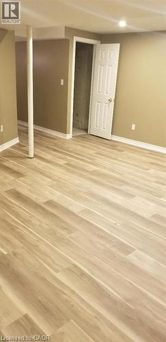 Finished basement with light wood-style floors and recessed lighting - 185 Sulmona Drive, Hamilton, ON - Indoor Photo Showing Other Room