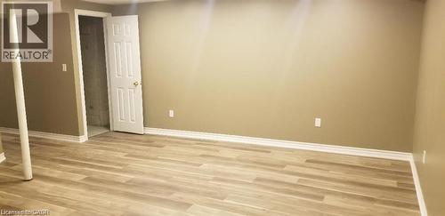 Unfurnished bedroom featuring light wood-style floors and a closet - 185 Sulmona Drive, Hamilton, ON - Indoor Photo Showing Other Room