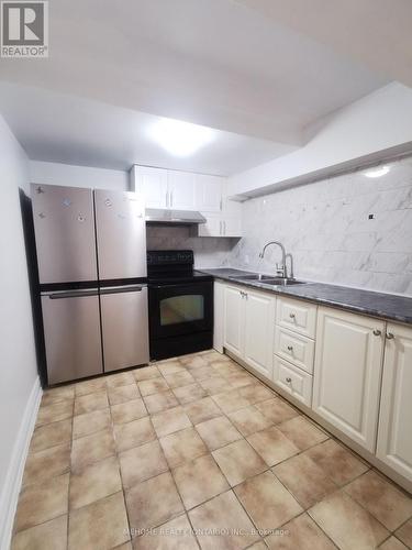 Ground - 66 Micmac Crescent, Toronto, ON - Indoor Photo Showing Kitchen With Double Sink