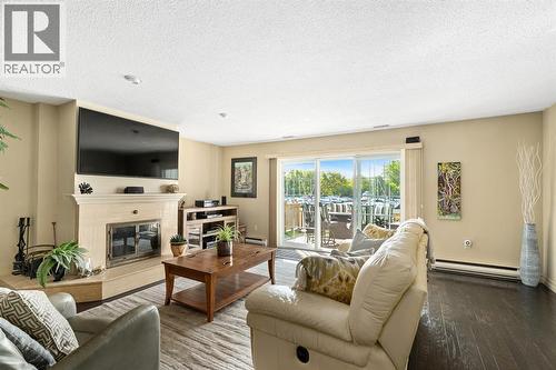 1500 Venetian Boulevard Unit# W-9, Point Edward, ON - Indoor Photo Showing Living Room With Fireplace