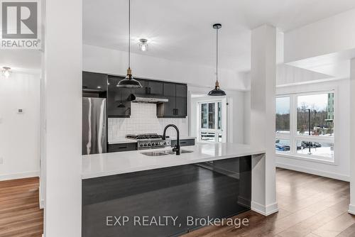 101 - 4 Spice Way, Barrie, ON - Indoor Photo Showing Kitchen With Upgraded Kitchen