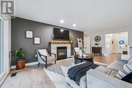 7003 Beatty Line N, Centre Wellington, ON - Indoor Photo Showing Living Room With Fireplace