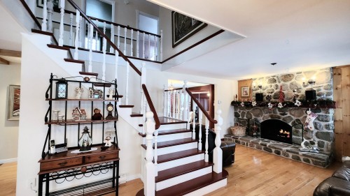 Staircase - 621 Boul. Robitaille, Notre-Dame-Du-Mont-Carmel, QC - Indoor Photo Showing Other Room With Fireplace