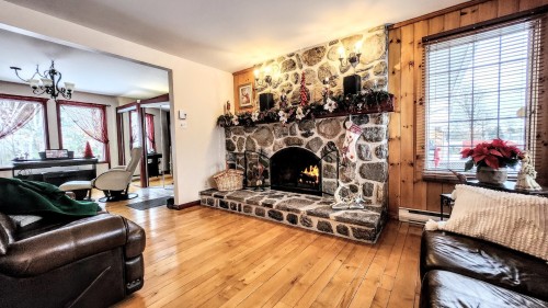 Living Room - 621 Boul. Robitaille, Notre-Dame-Du-Mont-Carmel, QC - Indoor Photo Showing Other Room With Fireplace
