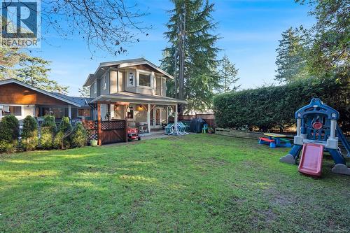 Back of cottage from yard - 2229 Arbutus Rd, Saanich, BC - Outdoor With Deck Patio Veranda