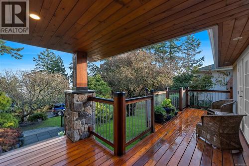 Wood deck includes French doors from primary bedroom - 2229 Arbutus Rd, Saanich, BC - Outdoor With Deck Patio Veranda With Exterior
