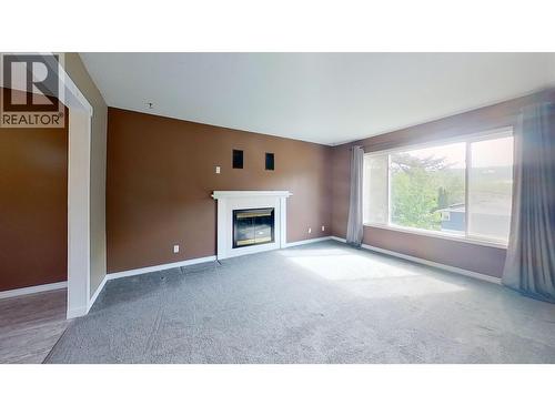 679 Jones Street, Quesnel, BC - Indoor Photo Showing Other Room With Fireplace
