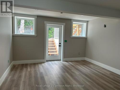 Living area with walk out to private outdoor patio - 2 - 242 South Rankin Street, Saugeen Shores, ON - Indoor Photo Showing Other Room