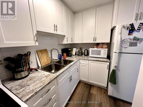 317 - 573 Armstrong Road, Kingston (East Gardiners Rd), ON - Indoor Photo Showing Kitchen With Double Sink