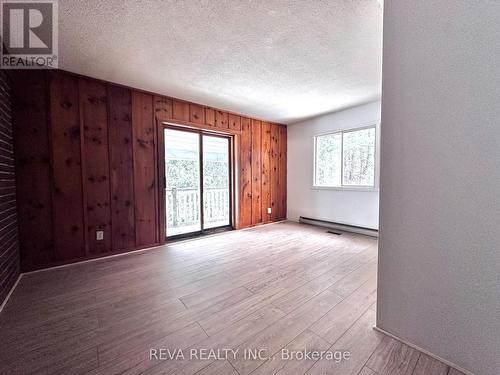 Primary Bedroom walk out to covered deck - 9 Stringer Road, Carlow/Mayo (Mayo Ward), ON - Indoor Photo Showing Other Room