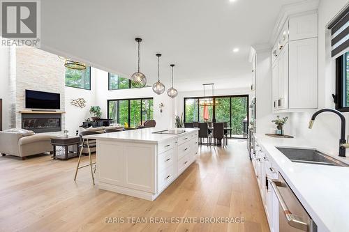 183 Woodland Drive, Wasaga Beach, ON - Indoor Photo Showing Kitchen With Fireplace With Double Sink With Upgraded Kitchen