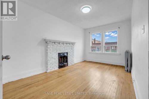 Upper - 1108 St. Clair Avenue W, Toronto, ON - Indoor Photo Showing Living Room With Fireplace