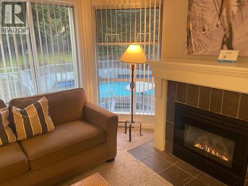 304 Week 2-4910 Spearhead Place, Whistler, BC - Indoor Photo Showing Living Room With Fireplace