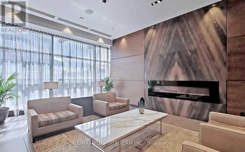 1303 - 2 Anndale Drive, Toronto, ON - Indoor Photo Showing Other Room With Fireplace