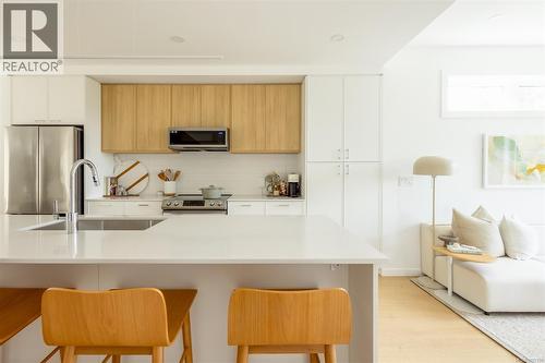 *Different floorplan, similar finishings - Th9 3450 Whittier Ave, Saanich, BC - Indoor Photo Showing Kitchen With Upgraded Kitchen