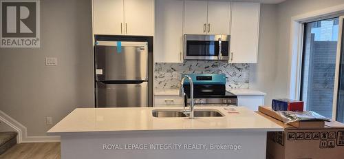 10 - 401 Glenroy Gilbert Drive, Ottawa, ON - Indoor Photo Showing Kitchen With Stainless Steel Kitchen With Double Sink