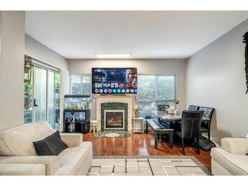 102 13727 74 Avenue, Surrey, BC - Indoor Photo Showing Living Room With Fireplace