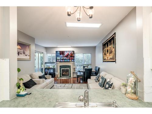 102 13727 74 Avenue, Surrey, BC - Indoor Photo Showing Living Room With Fireplace