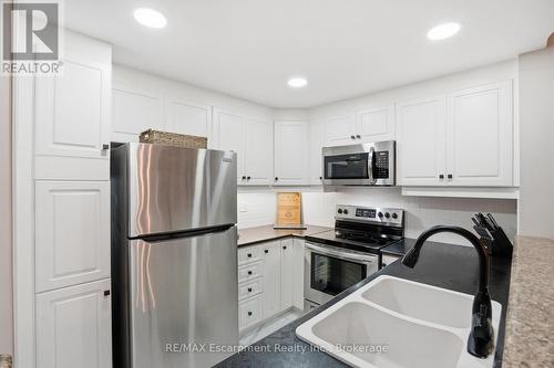 310 - 5188 Lakeshore Road, Burlington (Appleby), ON - Indoor Photo Showing Kitchen With Stainless Steel Kitchen With Double Sink